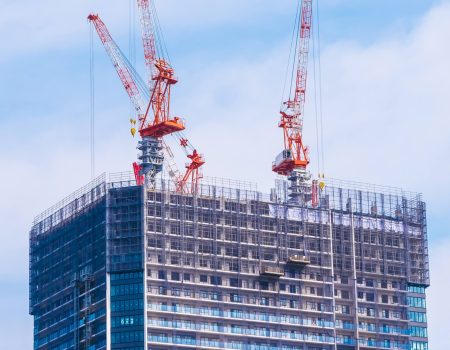 Crane building under construction exterior with sky background